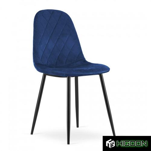 Dining chair with a navy blue velvet seat and sleek metal legs