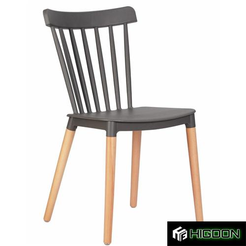 Grey plastic dining chair with wood legs