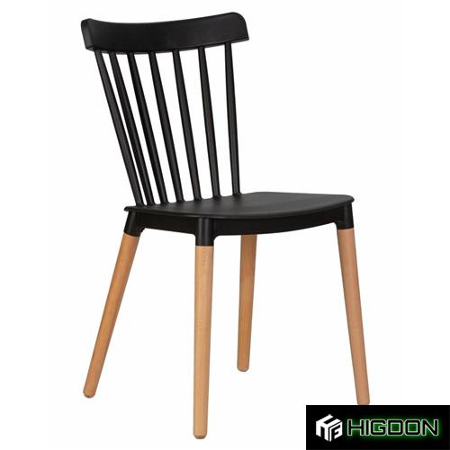 Black plastic dining chair with wood legs