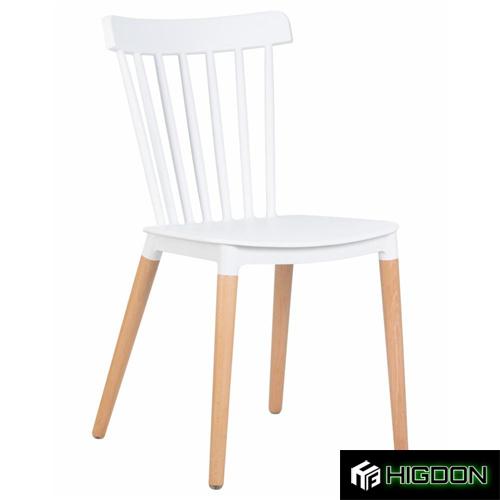 White plastic dining chair with wood legs