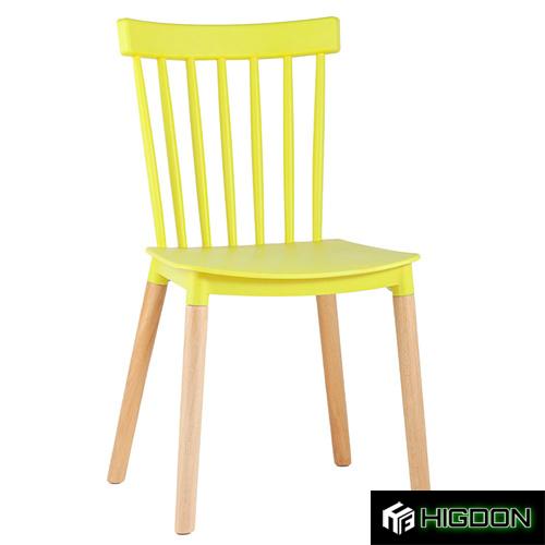 Plastic chair with a yellow PP seat and wood legs