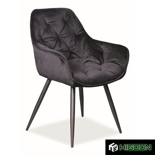 Tufted velvet dining chair with metal legs and armrests