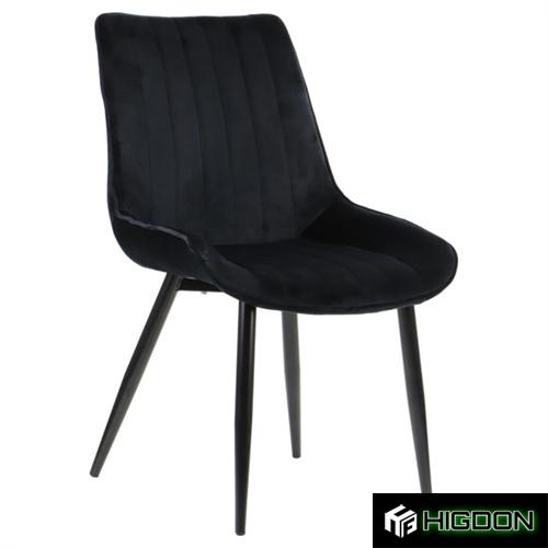 Black velvet dining chair with metal feet