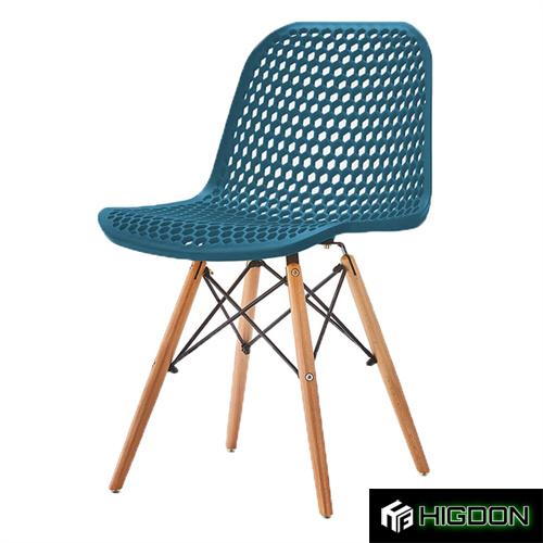 Hollow out plastic chair with eiffel wood legs