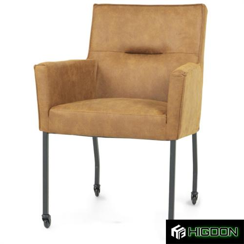 Brown armrest dining chair on wheels