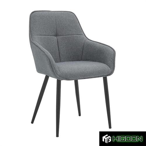 Dining armchair with a dark grey fabric upholstery and metal base