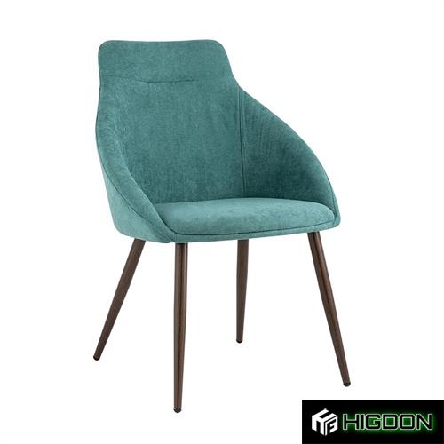 Dining chair with its Turquoise fabric seat and black metal legs 