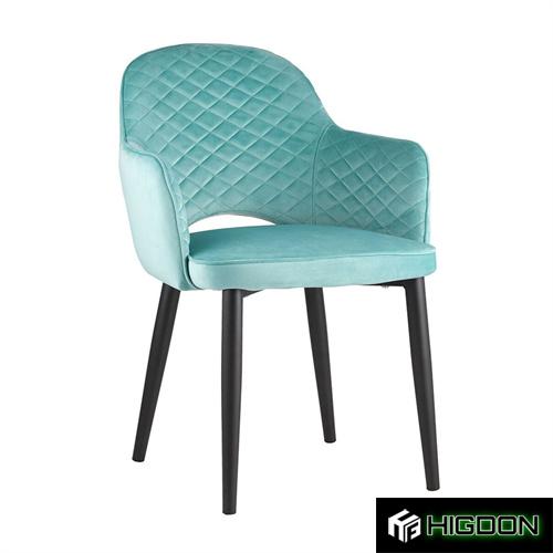 Luxurious teal velvet dining armchair with black metal feet