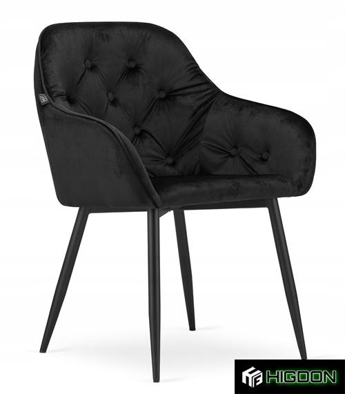 Dining Armchair with its black tufted velvet seat and black metal feet