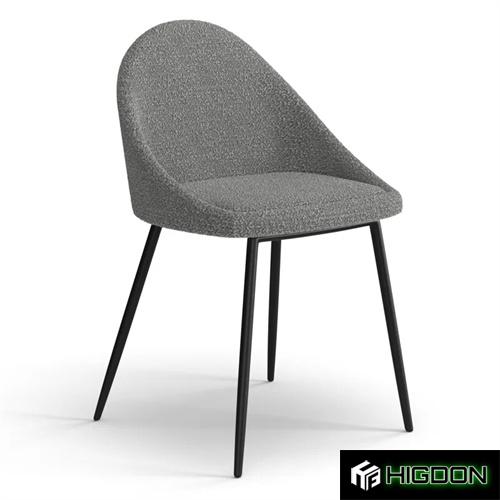 Stylish dark grey boucle dining chair with black metal feet